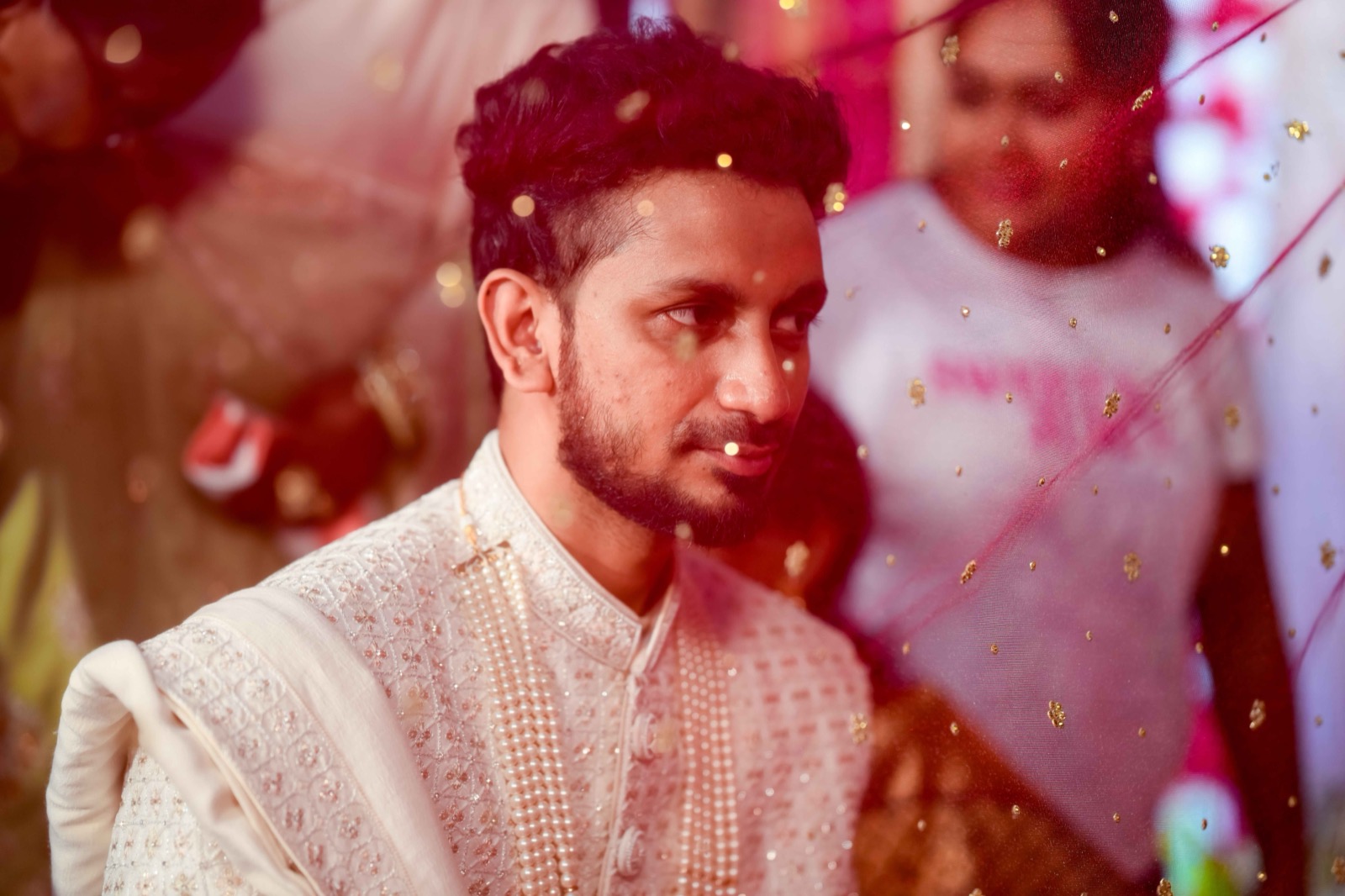 Groom watching bride